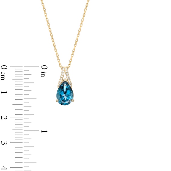 Pear-Shaped London Blue Topaz and 0.04 CT. T.W. Diamond Pendant in 10K Gold