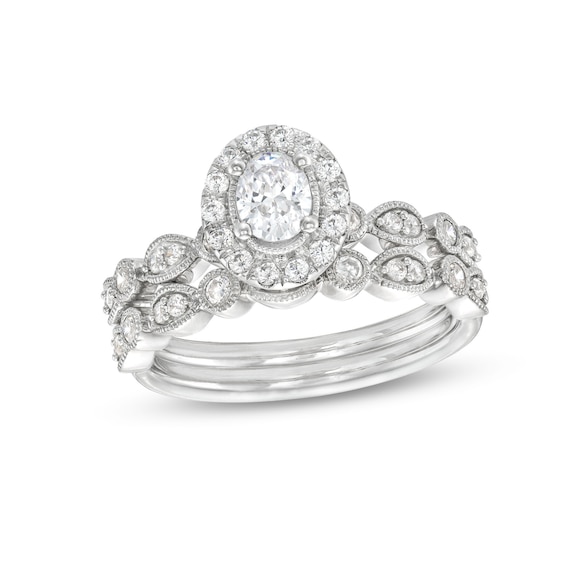 0.70 CT. T.W. Oval Diamond Frame Vintage-Style Bridal Set in 14K White Gold (I/I1)