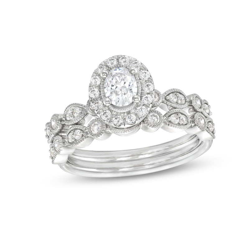 0.70 CT. T.W. Oval Diamond Frame Vintage-Style Bridal Set in 14K White Gold (I/I1)|Peoples Jewellers