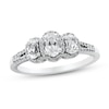 0.95 CT. T.W. Oval Diamond Frame Three Stone Split Shank Engagement Ring in 14K White Gold (I/I1-SI2)