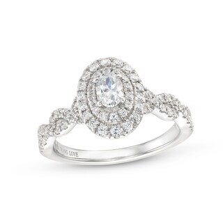 Vera Wang Love Collection Canadian Certified Oval Centre Diamond 0.69 CT. T.W. Twist Engagement Ring in 14K White Gold