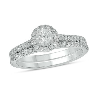 0.71 CT. T.W. Diamond Frame Hidden Infinity Bridal Set in 10K White Gold