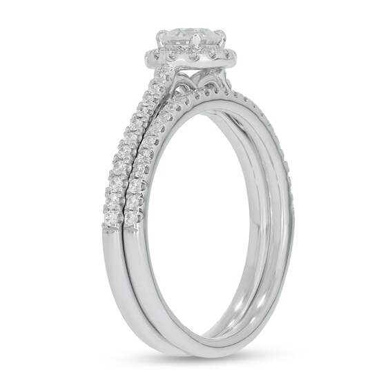 0.71 CT. T.W. Diamond Frame Hidden Infinity Bridal Set in 10K White Gold