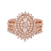 1.23 CT. T.W. Oval Multi-Diamond Sunburst Frame Split Shank Bridal Set in 10K Rose Gold