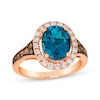 Le Vian® Oval Deep Sea Blue Topaz™ and 0.50 CT. T.W. Diamond Frame Ring in 14K Strawberry Gold®