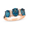 Thumbnail Image 0 of Le Vian® Oval Deep Sea Blue Topaz™ and 0.25 CT. T.W. Diamond Three Stone Ring in 14K Strawberry Gold®