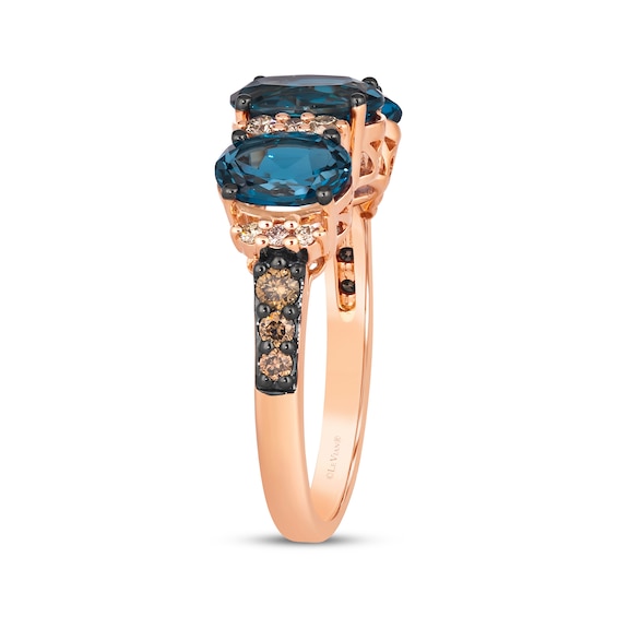 Le Vian® Oval Deep Sea Blue Topaz™ and 0.25 CT. T.W. Diamond Three Stone Ring in 14K Strawberry Gold®