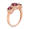 Rhodolite Garnet and 0.30 CT. T.W. Diamond Frame Three Stone Ring in 10K Rose Gold