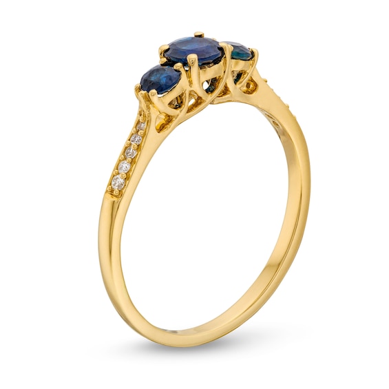 Blue Sapphire and 0.04 CT. T.W. Diamond Three Stone Ring in 10K Gold