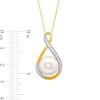 11.0mm Freshwater Cultured Pearl and 0.23 CT. T.W. Diamond Infinity Ribbon Pendant in 10K Gold