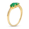 Thumbnail Image 2 of Oval Emerald and 0.05 CT. T.W. Diamond Three Stone Ring in 10K Gold