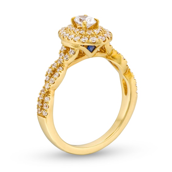 Vera Wang Love Collection Canadian Certified Oval Centre Diamond 0.69 CT. T.W. Twist Shank Engagement Ring in 14K Gold