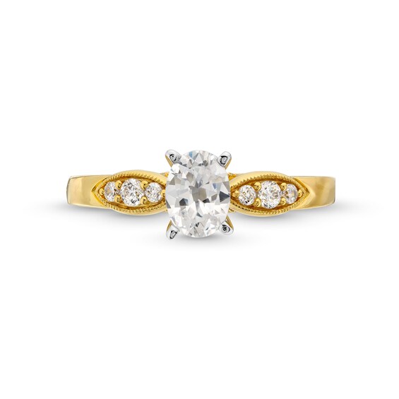 0.69 CT. T.W. Oval Diamond Leaf-Sides Engagement Ring in 14K Gold