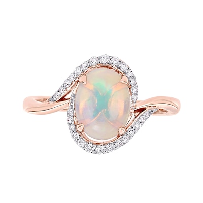 Oval Opal and 0.146 CT. T.W. Diamond Swirl Bypass Frame Ring in 10K Rose Gold