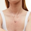 Thumbnail Image 1 of Unstoppable Love™ 0.25 CT. T.W. Diamond Dangle Double Heart Pendant in 10K Gold