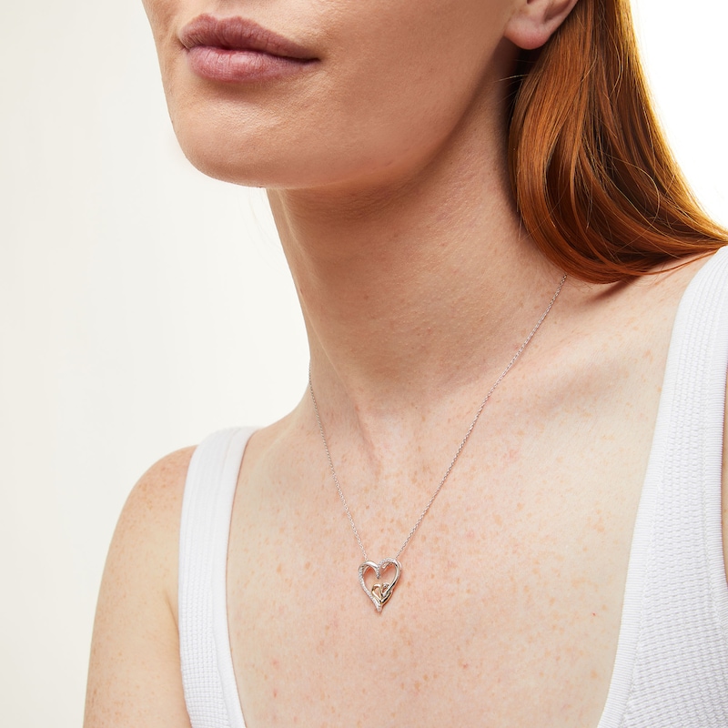 0.085 CT. T.W. Diamond Intertwined Double Heart Pendant in Sterling Silver and 10K Gold|Peoples Jewellers