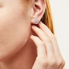 Thumbnail Image 1 of Circle of Gratitude® 0.20 CT. T.W. Baguette and Round Diamond Twist Stud Earrings in 10K White Gold