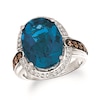 Thumbnail Image 0 of Le Vian® Chocolatier® Oval Deep Sea Blue Topaz™ and 0.47 CT. T.W. Diamond Frame Ring in 14K Vanilla Gold®