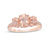 Previously Owned - Oval Morganite and 0.04 CT. T.W. Diamond Three Stone Ring in 10K Rose Gold