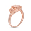 Previously Owned - Oval Morganite and 0.04 CT. T.W. Diamond Three Stone Ring in 10K Rose Gold