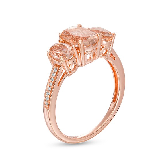 Previously Owned - Oval Morganite and 0.04 CT. T.W. Diamond Three Stone Ring in 10K Rose Gold