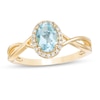 Thumbnail Image 0 of Previously Owned - Oval Swiss Blue Topaz and 0.08 CT. T.W. Diamond Frame Twist Shank Ring in 10K Gold