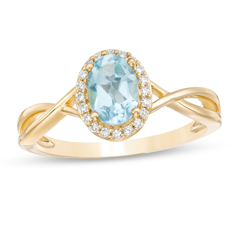 Previously Owned - Oval Swiss Blue Topaz and 0.08 CT. T.W. Diamond Frame Twist Shank Ring in 10K Gold