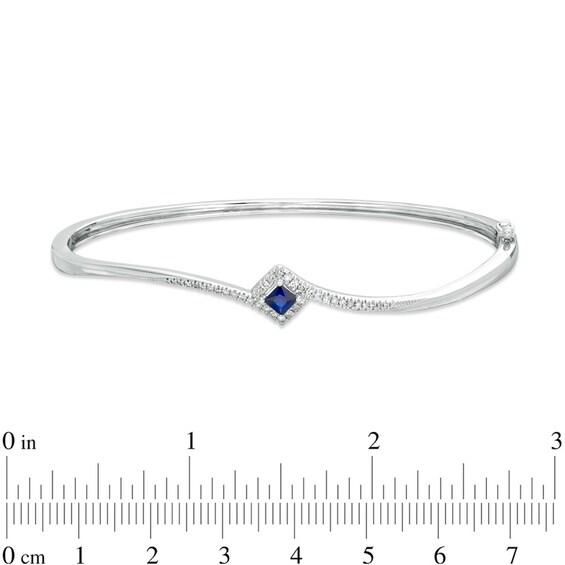 Previously Owned - Vera Wang Love Collection Blue Sapphire and 0.18 CT. T.W. Diamond Bypass Bangle in Sterling Silver