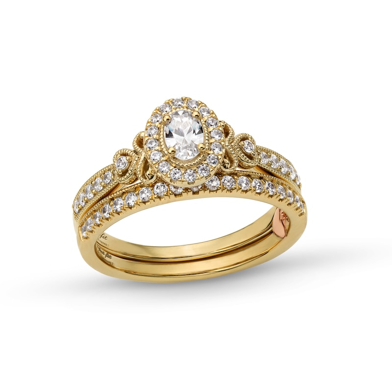 Perfect Fit 0.60 CT. T.W. Oval Certified Lab-Created Diamond Heart-Sides Vintage-Style Bridal Set in 14K Gold (F/SI2)|Peoples Jewellers