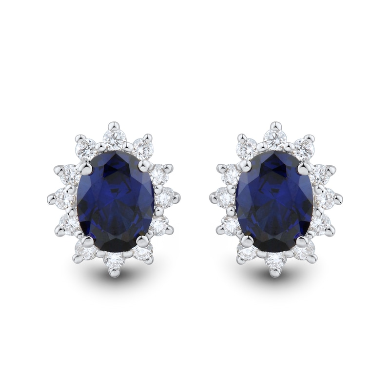 Oval Blue Lab-Created Sapphire and 0.45 CT. T.W. Certified Lab-Created Diamond Sunburst Stud Earrings in 10K White Gold|Peoples Jewellers