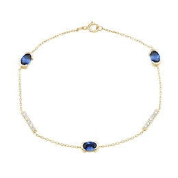 Oval Blue Lab-Created Sapphire and 0.18 CT. T.W. Certified Lab-Created Diamond Station Bracelet in 10K Gold - 7.25”