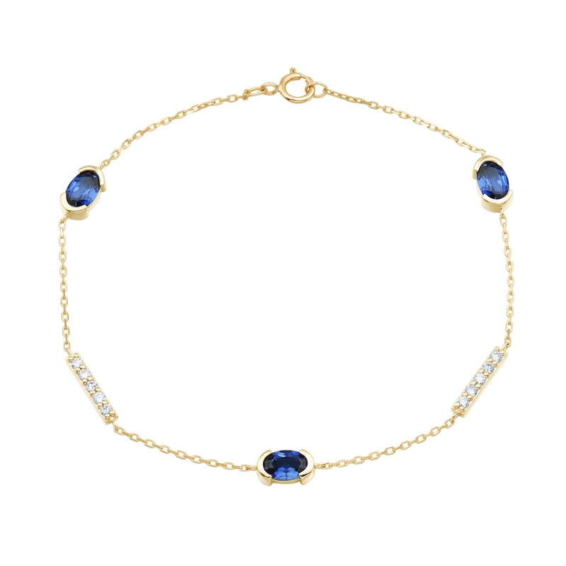 Oval Blue Lab-Created Sapphire and 0.18 CT. T.W. Certified Lab-Created Diamond Station Bracelet in 10K Gold - 7.25”|Peoples Jewellers