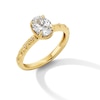 Thumbnail Image 1 of 0.99 CT. T.W. Oval Canadian Certified Diamond &quot;XO&quot; Shank Engagement Ring in 14K Gold (I/I1)