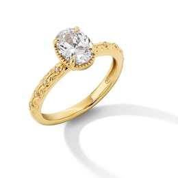 0.99 CT. T.W. Oval Canadian Certified Diamond &quot;XO&quot; Shank Engagement Ring in 14K Gold (I/I1)