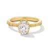 0.99 CT. T.W. Oval Canadian Certified Diamond "XO" Shank Engagement Ring in 14K Gold (I/I1)