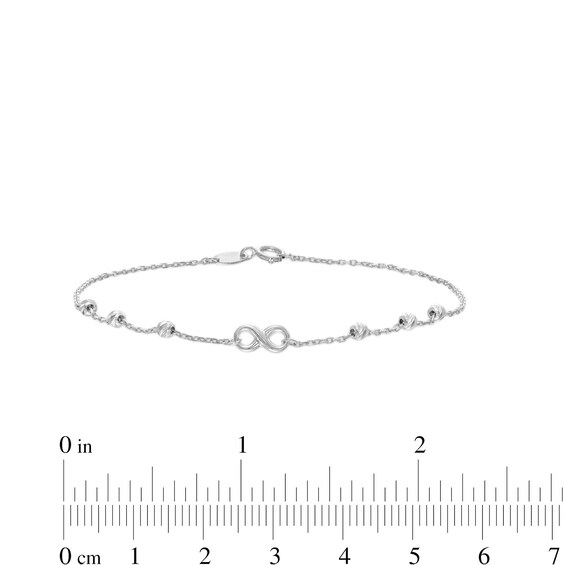 Infinity and Diamond-Cut Bead Station Bracelet in 10K White Gold - 7.5”