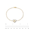 0.085 CT. T.W. Diamond Motherly Love Heart Bracelet in 10K Gold - 7.25"