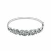 Previously Owned - 0.33 CT. T.W. Diamond Vintage-Inspired Swirl Bangle in Sterling Silver