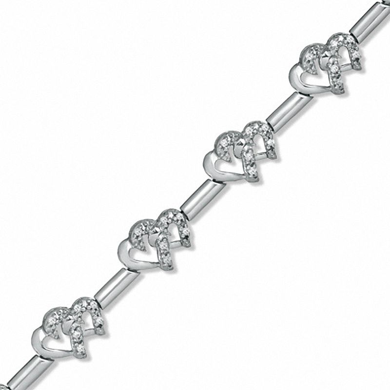 Previously Owned - 0.20 CT. T.W. Diamond Interlocking Hearts Link Bracelet in Sterling Silver
