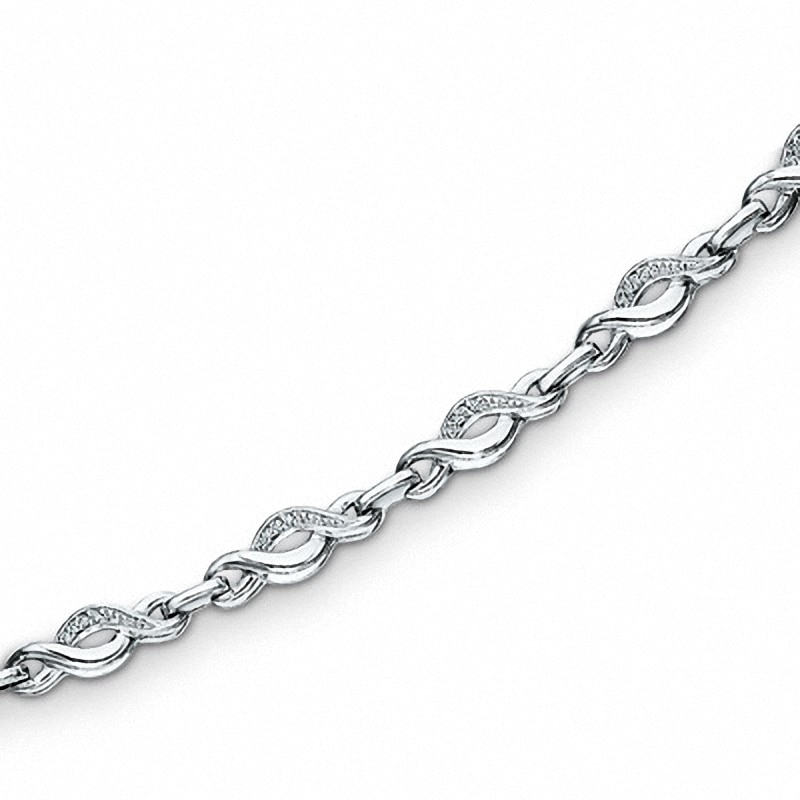 Previously Owned - 0.085 CT. T.W. Diamond Twist Bracelet in Sterling Silver - 7.25"