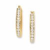 Previously Owned - 0.50 CT. T.W. Channel-Set Diamond Oval Hoop Earrings in 10K Gold