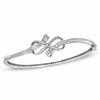 Thumbnail Image 0 of Previously Owned - 0.33 CT. T.W. Diamond Infinity Knot Bangle in Sterling Silver