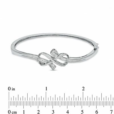 Previously Owned - 0.33 CT. T.W. Diamond Infinity Knot Bangle in Sterling Silver