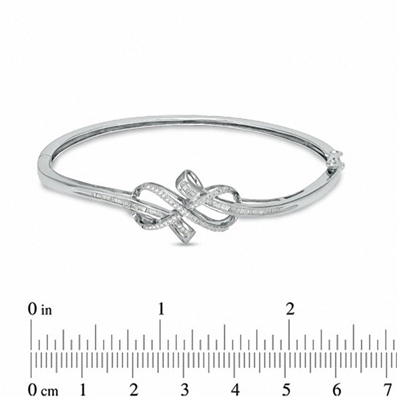 Previously Owned - 0.33 CT. T.W. Diamond Infinity Knot Bangle in Sterling Silver|Peoples Jewellers