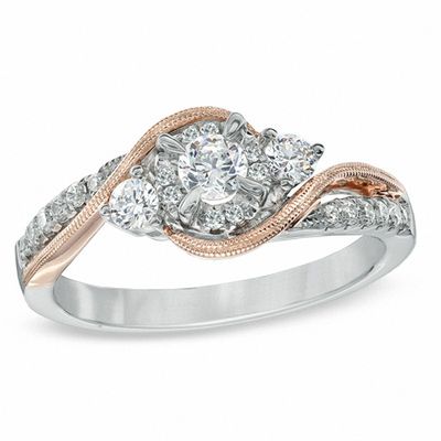 Previously Owned - 0.50 CT. T.W. Diamond Three Stone Swirl Engagement Ring in 10K Two-Tone Gold