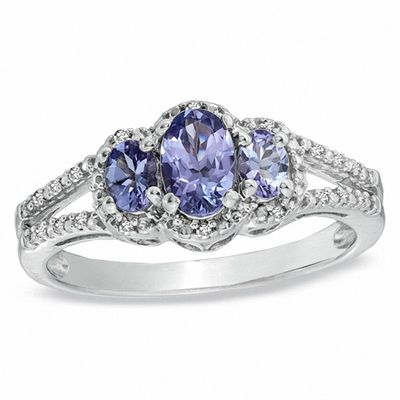 Previously Owned - Oval Tanzanite and Diamond Accent Three Stone Ring in Sterling Silver