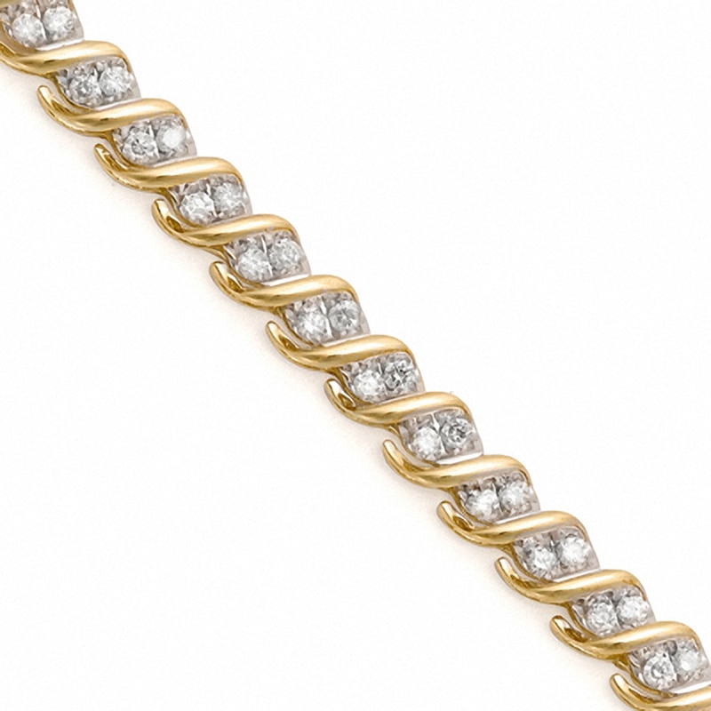 Previously Owned - 1.50 CT. T.W. Diamond Cascading Tennis Bracelet in 10K Gold - 7.25"