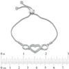 Previously Owned - 0.10 CT. T.W. Diamond Heart Station Bolo Bracelet in Sterling Silver - 9.5"