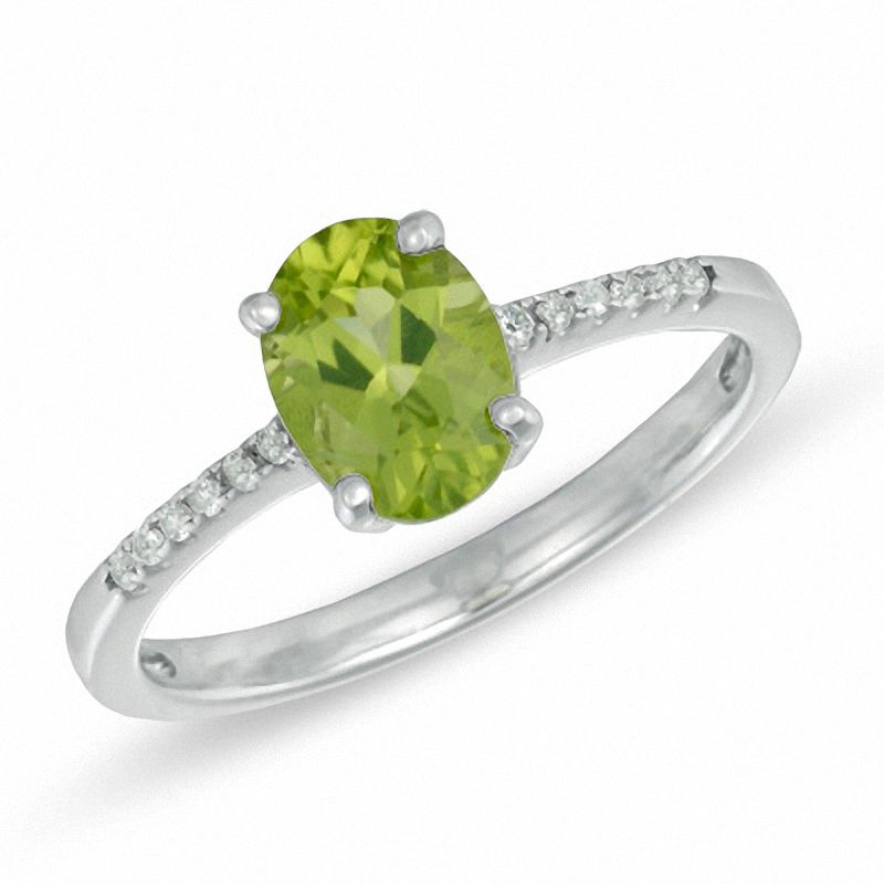 Previously Owned - Oval Peridot and Lab-Created White Sapphire Ring in Sterling Silver