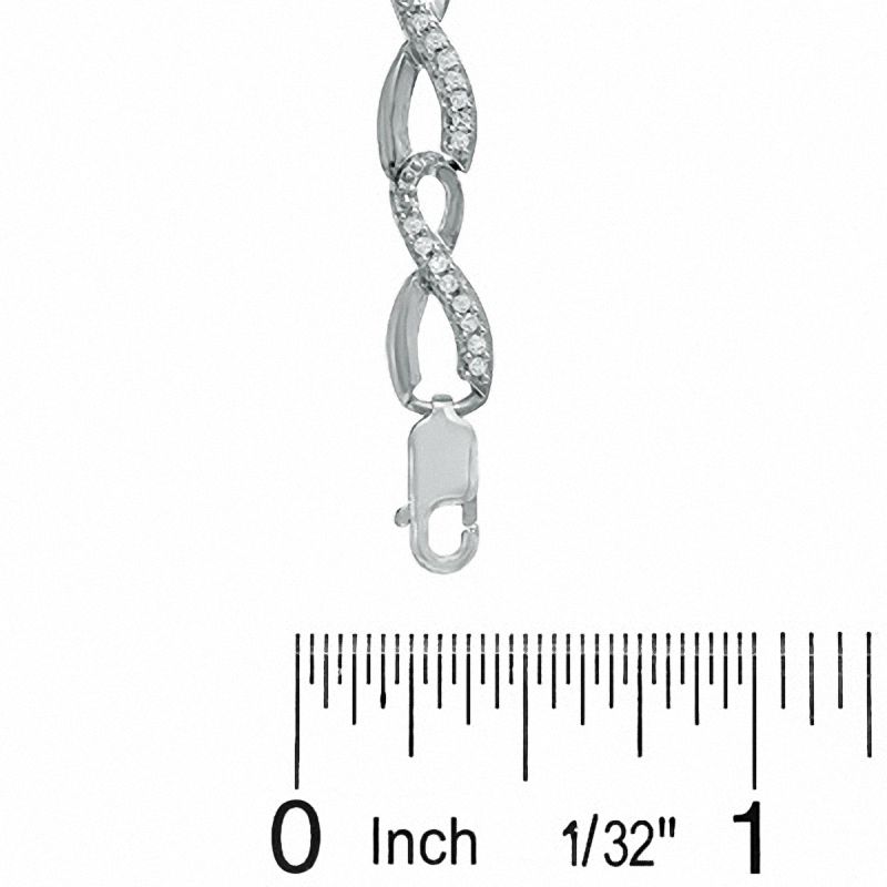 Previously Owned - 0.50 CT. T.W. Diamond Infinity Loop Bracelet in Sterling Silver